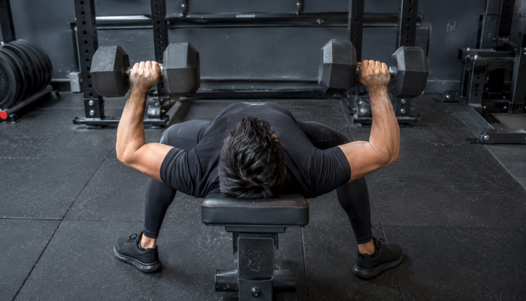  Overhead view of lifter performing dumbbell bench press