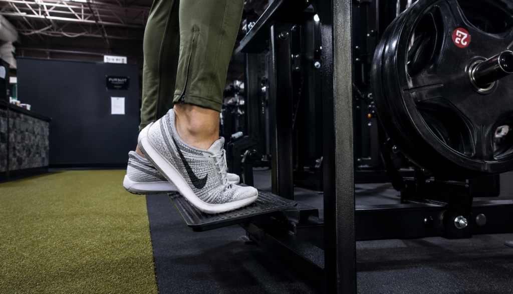 Close crop of feet and calves during a single-leg calf raise