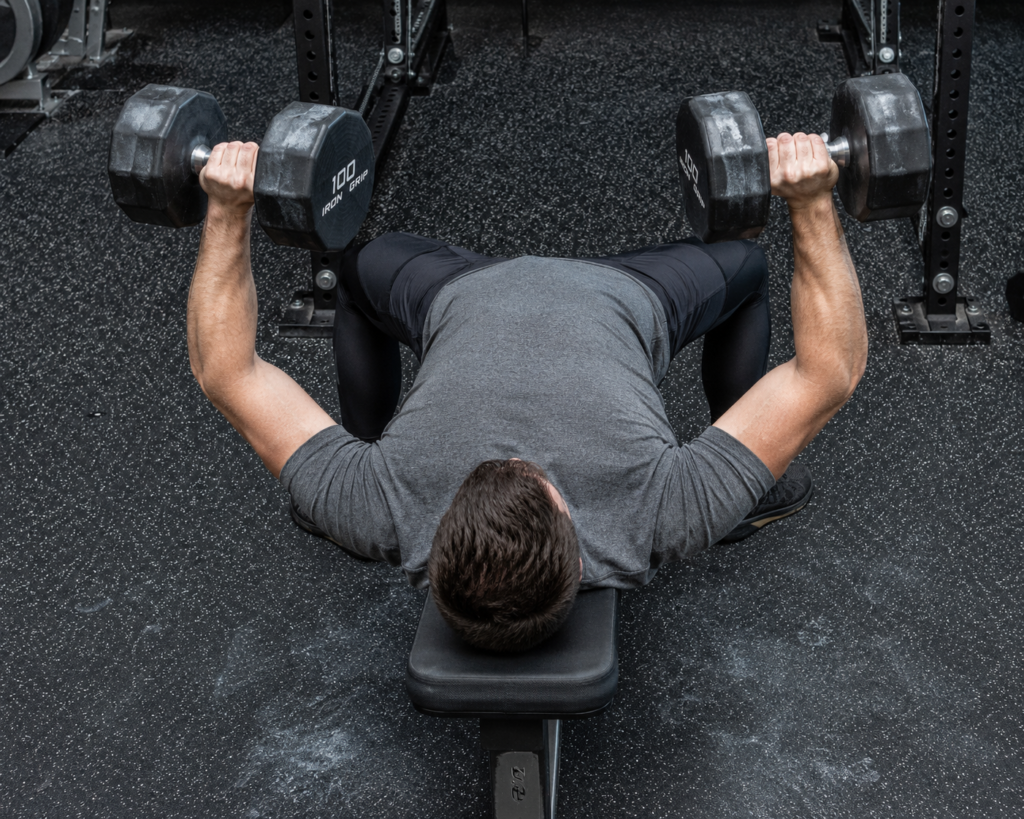 Overhead view of lifter performing dumbbell bench press