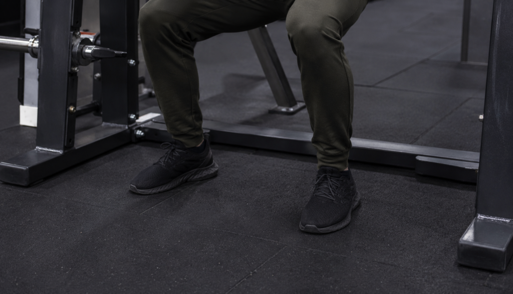 Close-up of a lifter's stance during a Smith machine squat