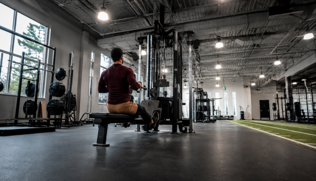 Lifter performing a cable row exercise in a gym