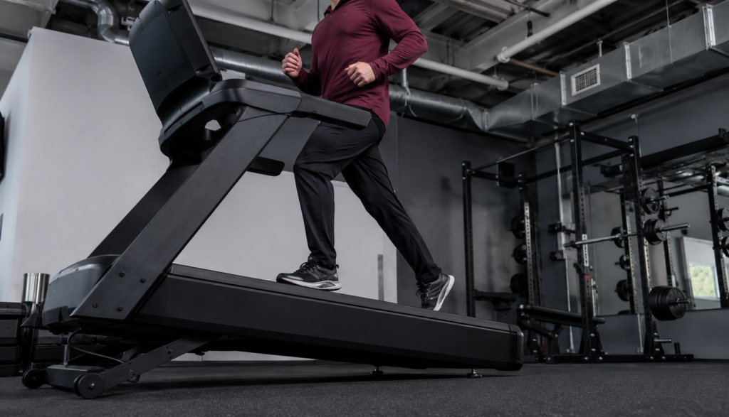 Runner on treadmill incline interval, low upward angle