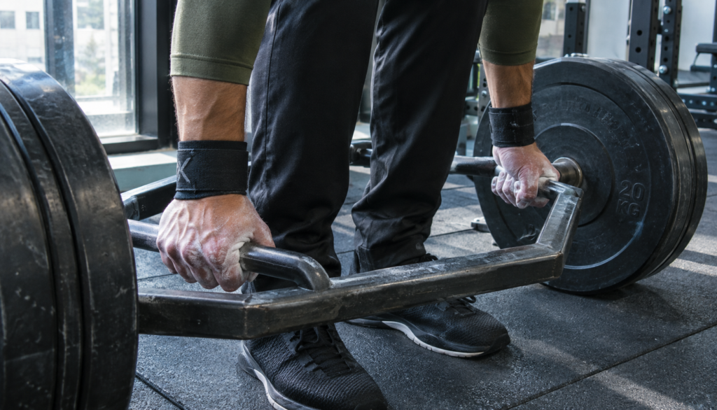 Close-up of hands gripping a trap bar