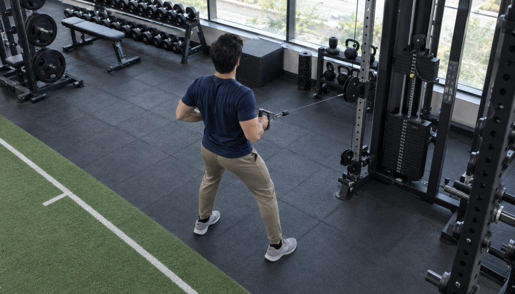 Lifter performing a cable row in a well-lit gym